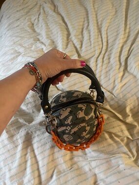 Green LV Patterned Tomme Women’s basketball purse with Orange Chain Accent